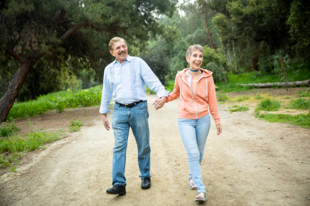 istock Senior Couple on Nature Walk 1138724060