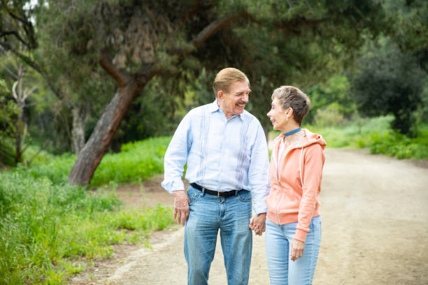 istock Senior Couple on Nature Walk 1138725398