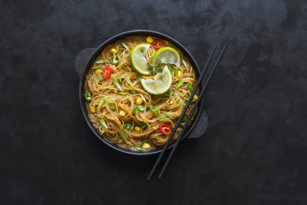 istock Coconut curry noodle on a black table. Top view. 1138729043