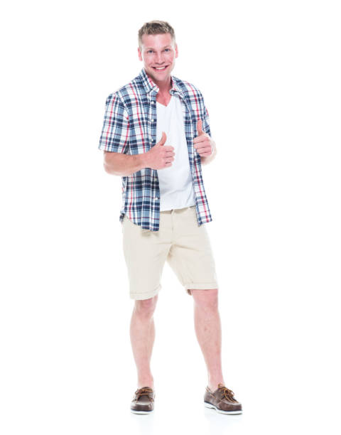 istock Handsome man in shirt and shorts is feeling happy 1138729222