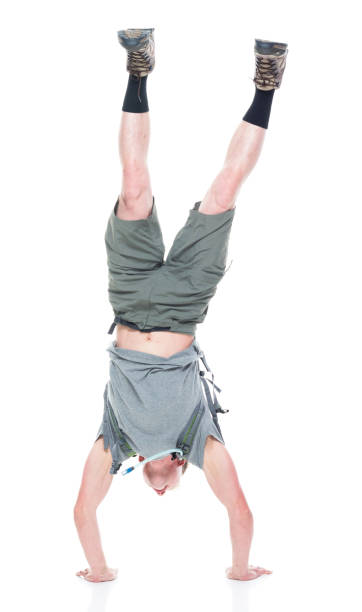 istock Friendly male hiker is doing a handstand 1138734072