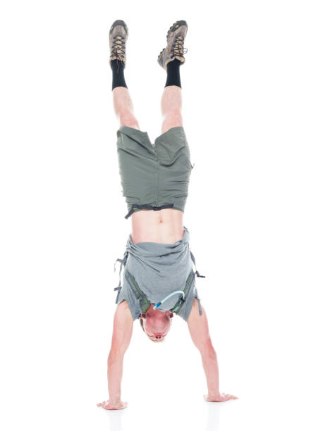 istock Friendly male hiker is doing a handstand 1138734102