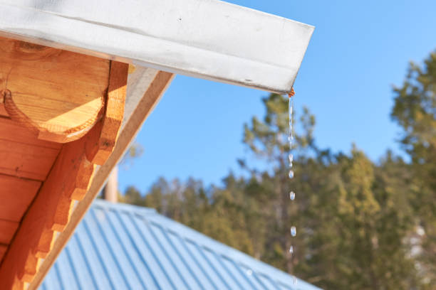 istock Close up the drops water the gutter flows. Against the blue sky. 1138734106