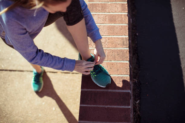 istock Woman Tying Shoelaces 1138737859