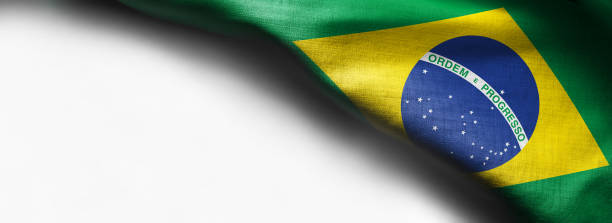 istock Brazilian flag fabric on white background - right top corner flag 1138740550