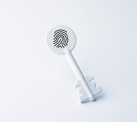 White key with fingerprint. Technology for digital biometric cyber security and identification.