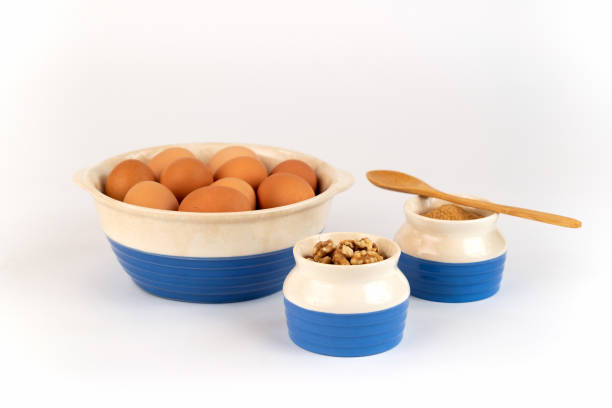 istock Farm Fresh Organic Free Range Eggs, Walnuts, Organic Sugar in Blue and White Bowls. 1138742747