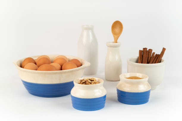 istock Farm Fresh Organic Free Range Eggs, Walnuts, Organic Sugar in Blue and White Bowls. 1138742760