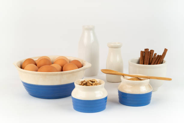Farm Fresh Organic Free Range Eggs, Walnuts, Organic Sugar in Blue and White Bowls.