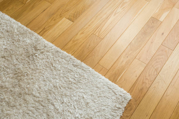 istock Laminate parquete floor. Light wooden texture. Beige soft carpet. Warm interior design 1138759709