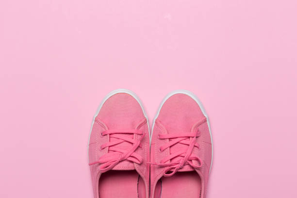 istock Pink shoes on a pastel background. Top view. Free space for text. 1138759818