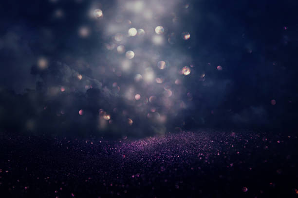 istock glitter vintage lights background. silver, black, purple and gold. de-focused 1138762990