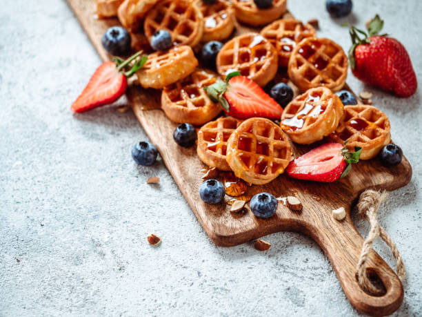 istock delicious soft belgian waffles with berries, copy space 1138769893
