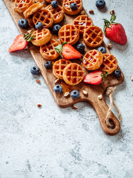 istock Delicious belgian waffles with berries, copy space 1138769910