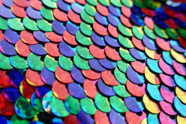 istock sequins colorful background.Mottled Scales Fabric Background.Sequins holographic macro background.Scales background. fabric background. sequined textile 1138770924