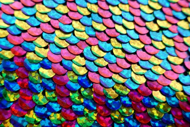istock sequins colorful background.Mottled Scales Fabric Background.Sequins holographic macro background.ridescent fabric.Scales background. fabric background. sequined textile 1138770927