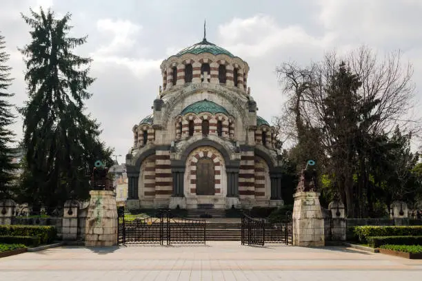 Photo of St. George the Conqueror Chapel Mausoleum in the city of Pleven, Bulgaria. Orthodox church in the city, memorial - The Eternal Fire