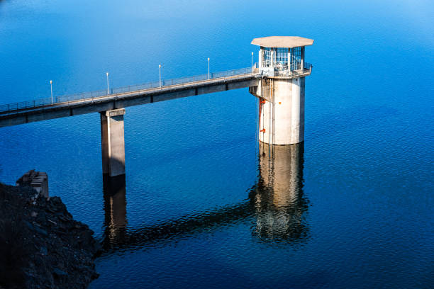 The Atazar reservoir and  control tower of Dam in the mountain range of Madrid