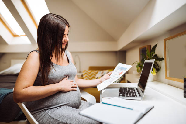 istock pregnant woman working at home 1138779484