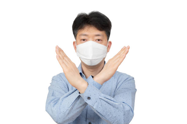 istock A middle-aged man wearing a mask on white background. 1138779611