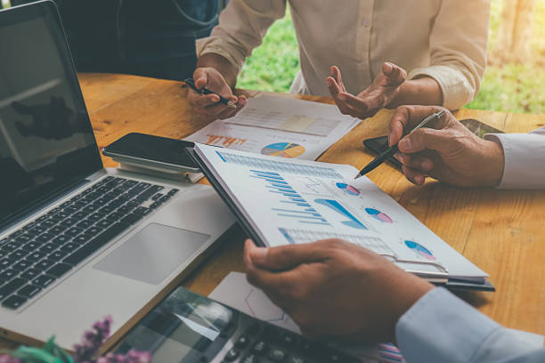 istock Business advisor analyzing financial figures denoting the progress Internal Revenue Service checking document. Audit concept 1138780375
