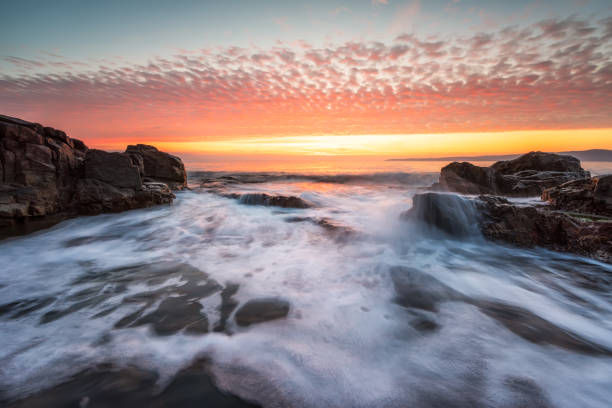istock Stormy sea  at the rocky coastline 1138780628