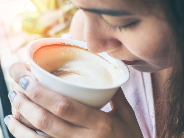 istock Woman hands holding a white hot coffee cup 1138780733