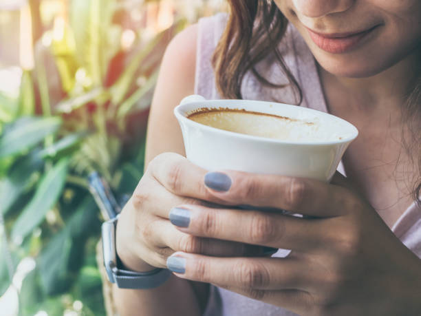 istock Woman hands holding a white hot coffee cup 1138780767
