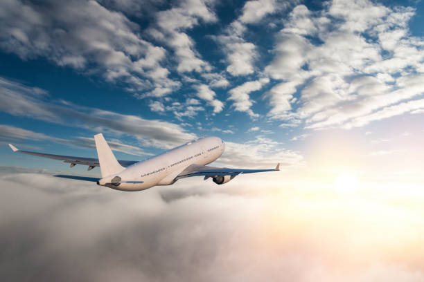 istock Commercial jet flying over clouds 1138781740