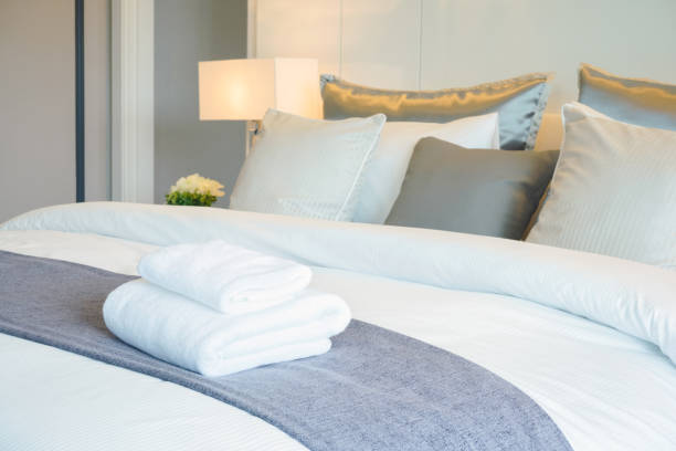 istock Clean towel on bed in modern interior bedroom 1138782562