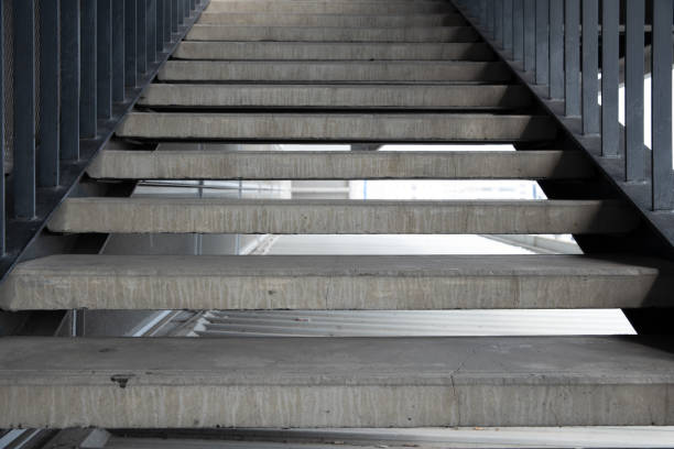 istock Empty concrete staircase with black steel handrail. 1138784882