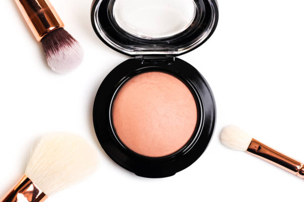istock eye shadow, blush, powder, sculptor in a pack with make up brushes on a white background. Isolated on white. - Image 1138786194