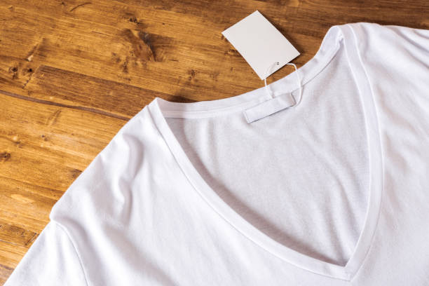 istock White t-shirt on a wooden background - Image 1138786580
