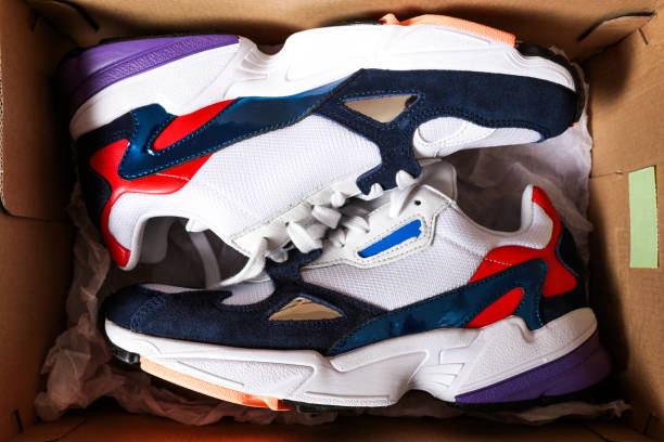 istock new sneakers in the box on wooden background- Image 1138787342