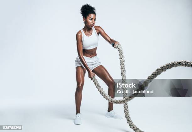 Athlete Working Out With Battle Ropes Stock Photo - Download Image Now - Exercising, Cross Training, Women