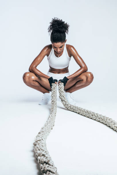 istock Exhausted woman resting after cross training 1138788590