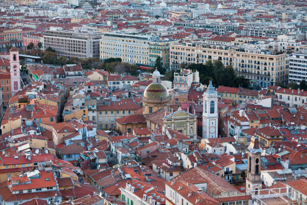 Nice, France - March 26 2019: Aerial view at sunset of the Nice Cathedral (French: Cathédrale Sainte-Réparate), the Church of the Gesù (French: Église Saint-Jacques-le-Majeur de Nice) and the Rusca Palace (French: Caserne Rusca).