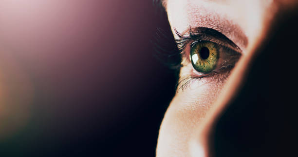 Open your eyes to what's in front of you Studio shot of a man opening his eyes against a dark background eye closeup stock pictures, royalty-free photos & images