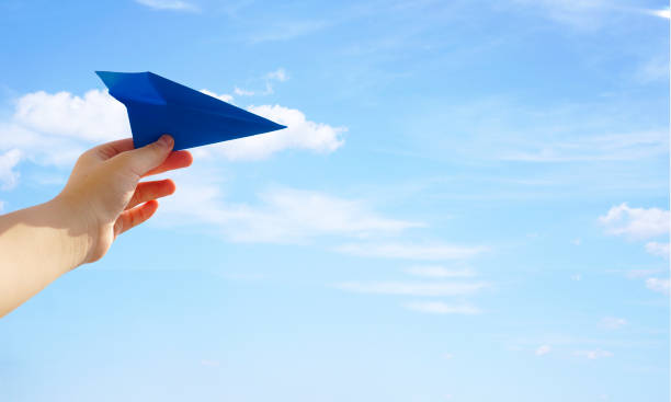 istock Hand with paper airplane symbolizing freedom 1138789823