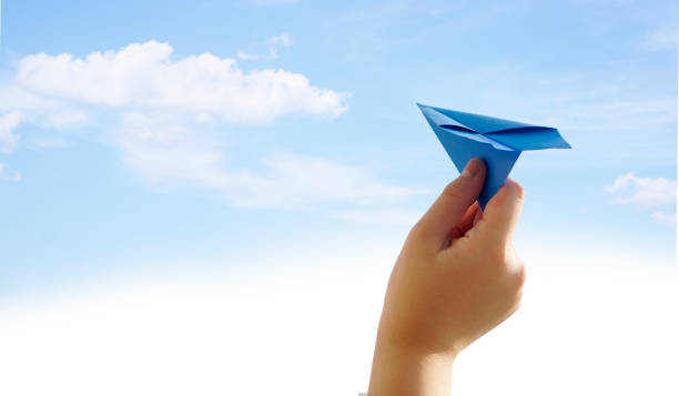 istock Hand with paper airplane symbolizing freedom 1138789914