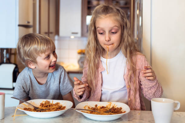istock Eating spaghetti with bolognese sauce 1138797488