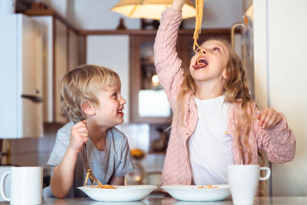 Eating spaghetti with bolognese sauce