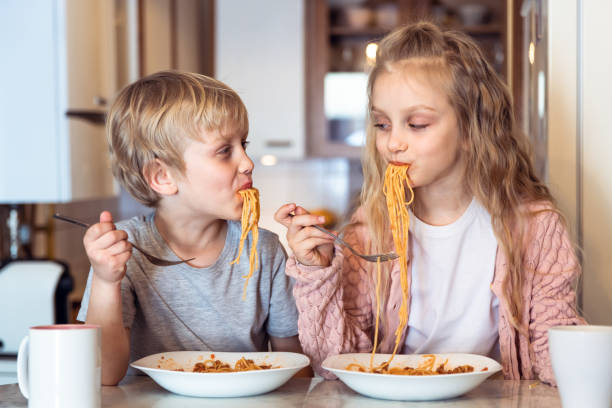 istock Eating spaghetti with bolognese sauce 1138797590