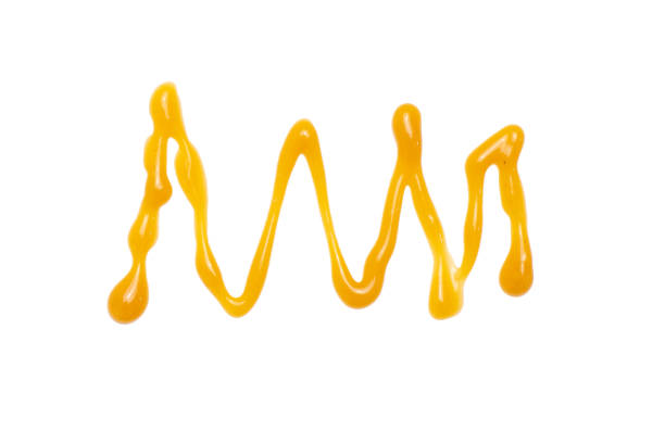 istock Flowing Sweet caramel sauce isolated on white background. Top view 1138797681