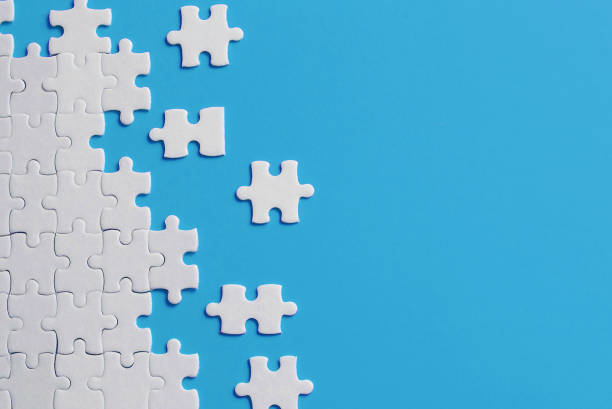 istock White details of puzzle on blue background 1138797685