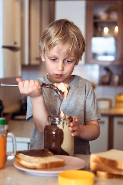 istock Eating bread with chocolate cream 1138798993
