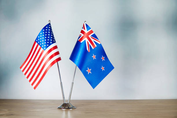 istock American and Australian flag standing on the table 1138800216