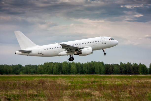 White passenger aircraft in the air on take-off