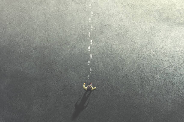 istock man following mysterious footsteps on the street 1138803603
