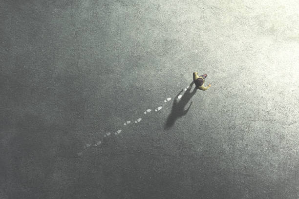 istock man walking in the streets leaving footsteps on the ground 1138803604